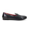 Black leather penny loafer with a red interior, displayed against a white background from Bed Stu.