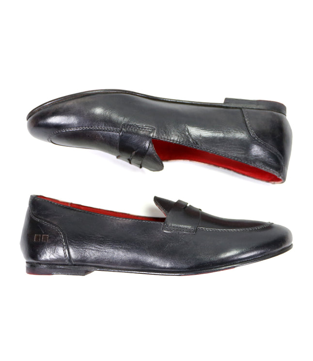 A pair of Bed Stu two-tone leather loafers with red soles, displayed on a white background.