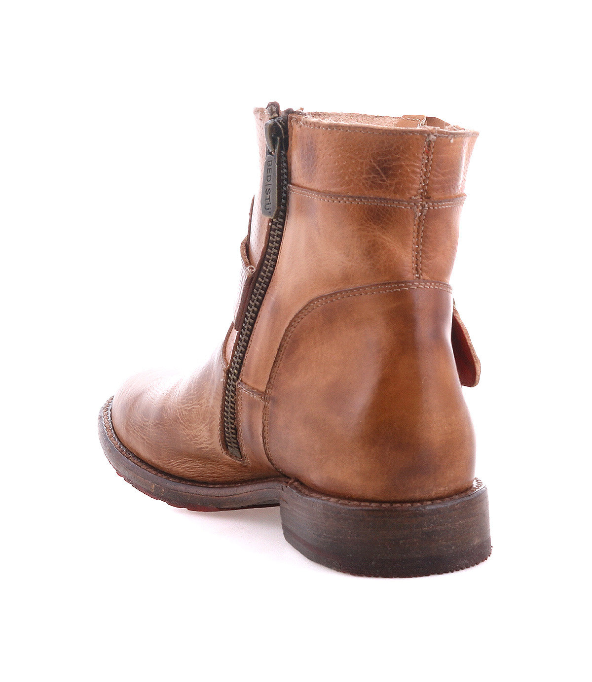 The Bed Stu Becca is a brown leather short engineer boot featuring dual zippers and an ankle buckle, shown from the back and side against a white background.