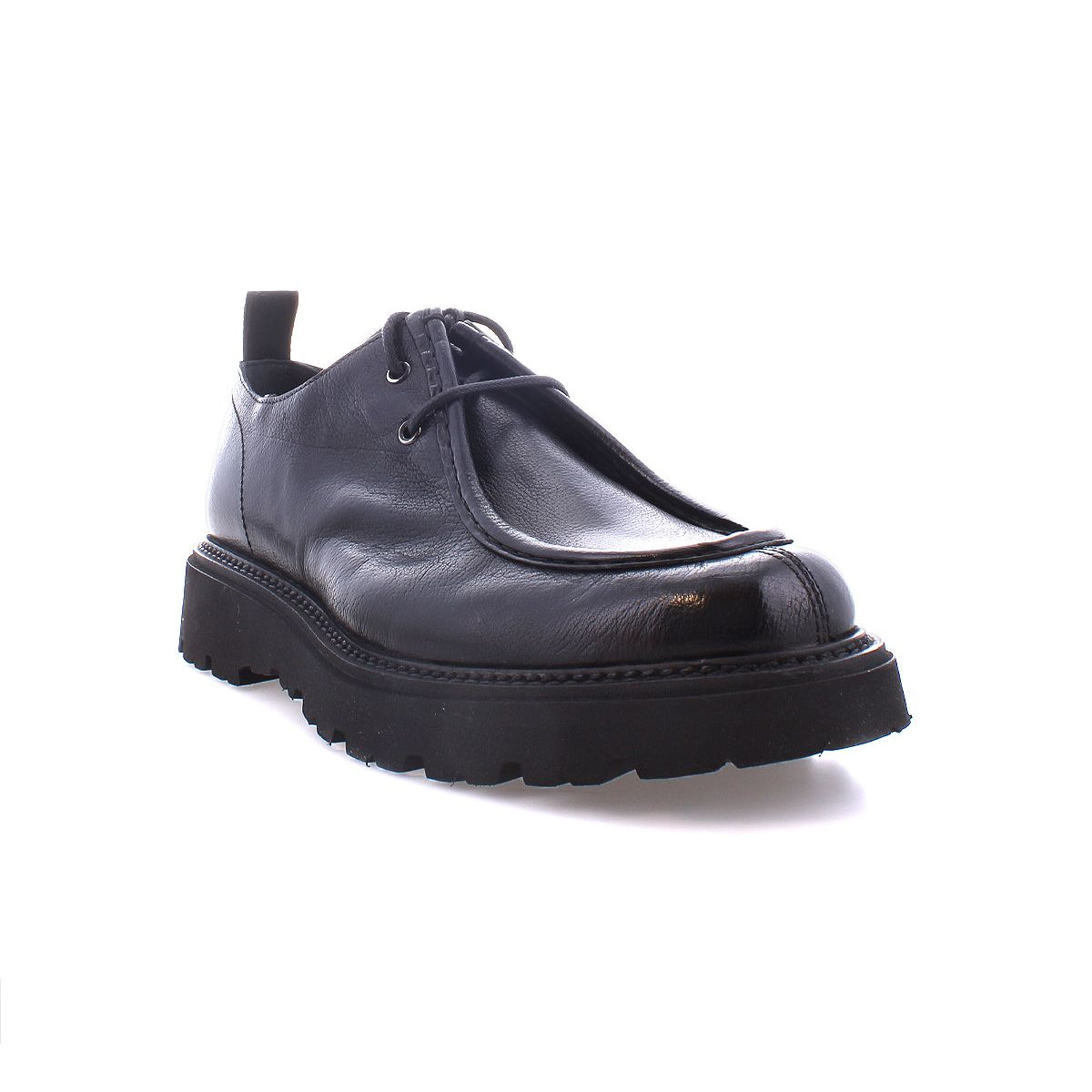 Introducing the "Casotto" by Bed Stu: A black leather shoe exuding retro charm, boasting a thick sole and classic front laces, showcased elegantly against a white background.