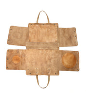 A multifunctional Bed Stu tan leather Commuter case with two compartments designed to hold laptops up to 15 inches.