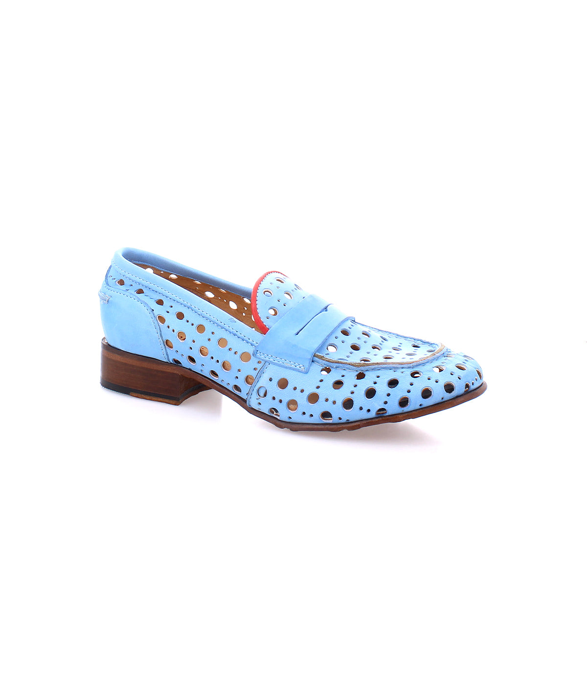 Cornflower by Bed Stu is a light blue perforated leather shoe with a wooden heel, featuring a playful circular cutout pattern and pink accents around the edges. This handcrafted beauty combines elegance with a unique design.