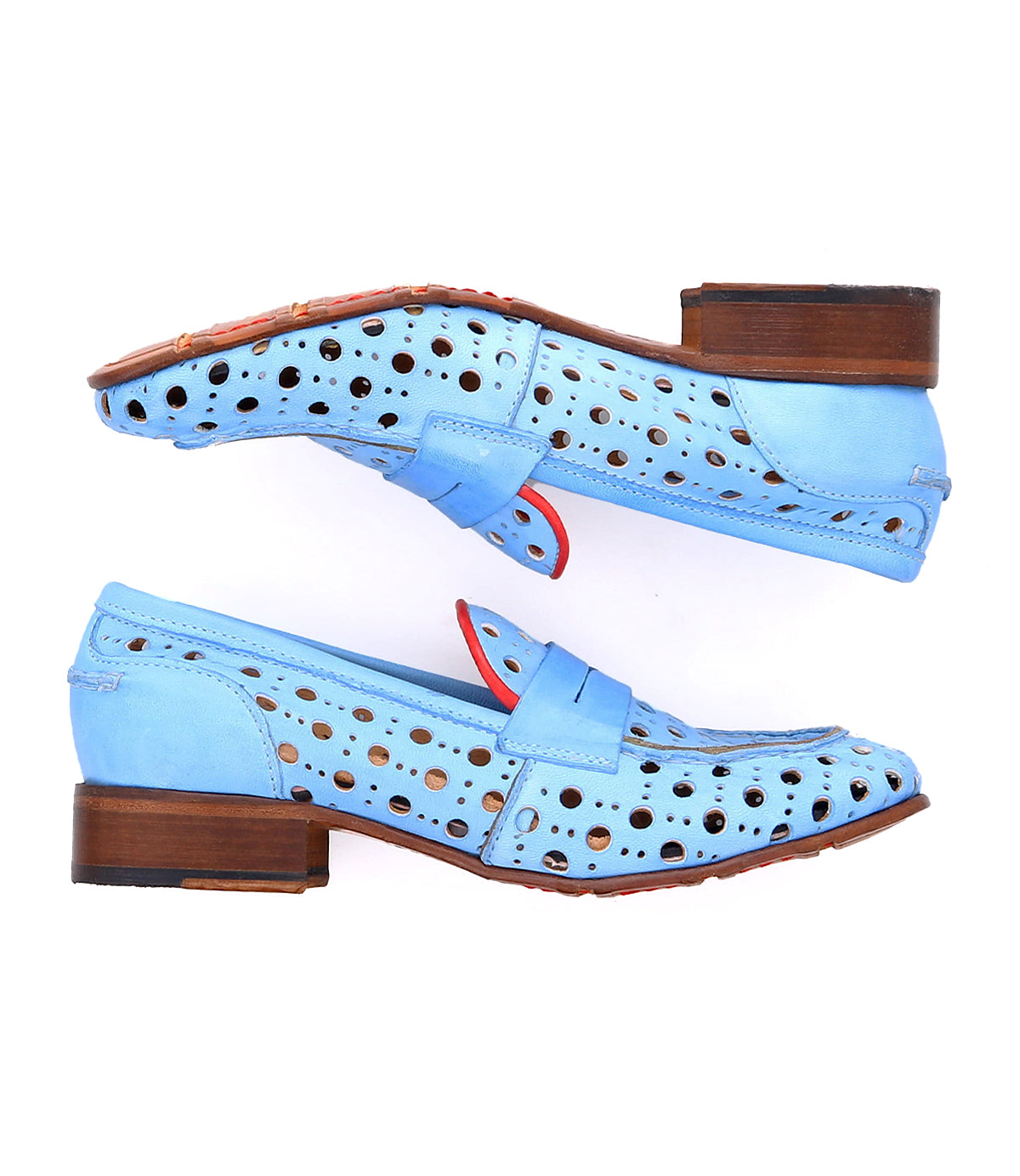 A pair of blue handcrafted dress shoes with wooden heels, a playful circular cutout pattern, red interior detailing, and a front strap from the Cornflower collection by Bed Stu.