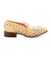 A beige leather penny loafer with a wooden heel and a playful circular cutout pattern, showcasing its handcrafted detailing, Cornflower by Bed Stu.