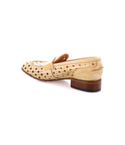 A beige handcrafted leather penny loafer with a wooden heel and a playful circular cutout pattern on a white background, named Cornflower by Bed Stu.