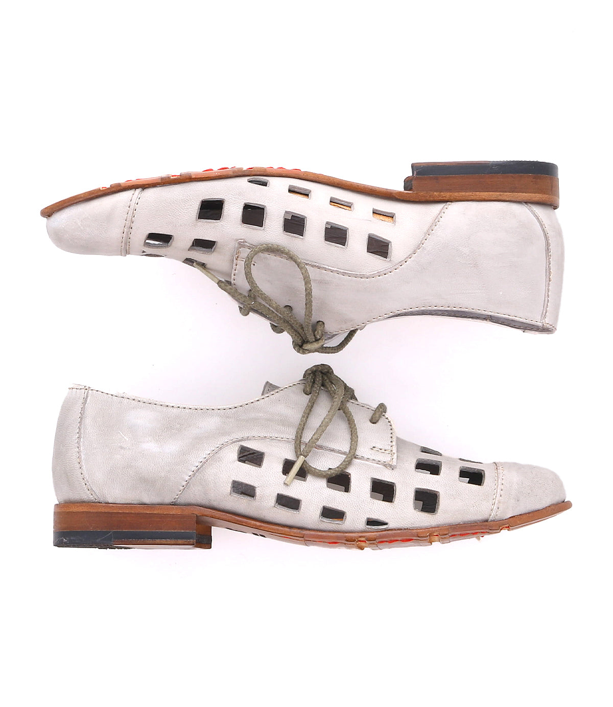 A pair of playful Decoy lace-up derby shoes by Bed Stu in light gray, featuring bold square cutouts on the sides, wooden heels, and vibrant orange soles. Handcrafted in Italy for exceptional quality and style.