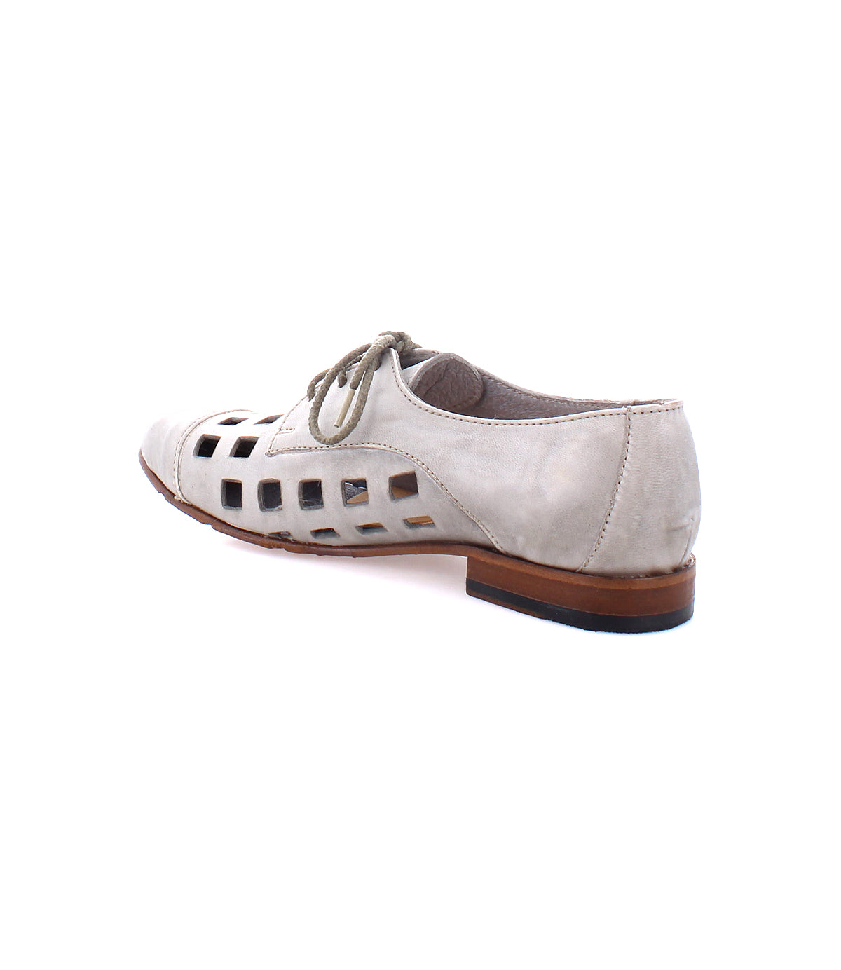 A handcrafted in Italy white leather Decoy by Bed Stu with bold square cutouts along the sides, a brown sole, and playful lace-up derby design viewed from the back.