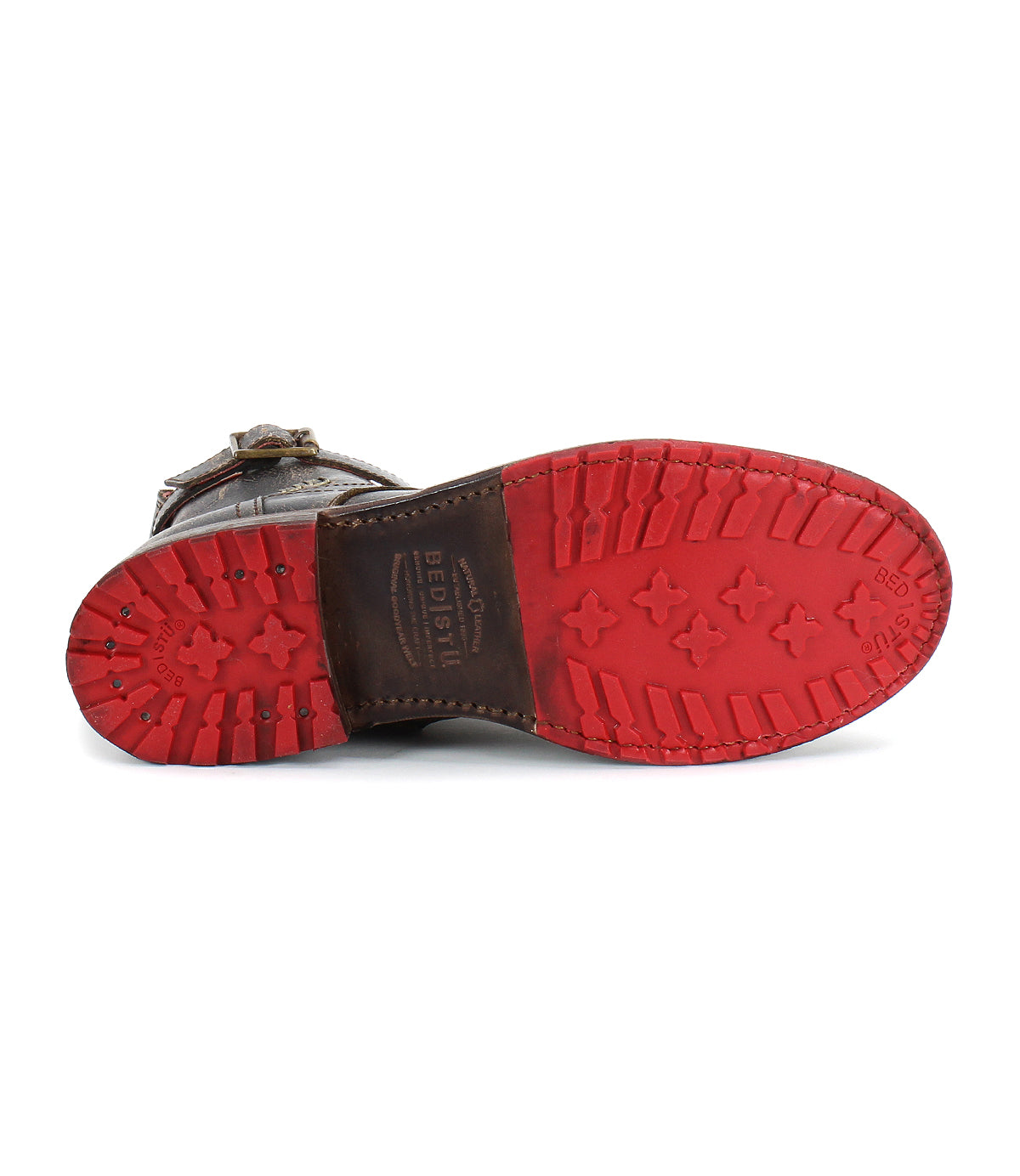 The underside of the Bed Stu Endure lace-up ankle boot displays rugged sophistication with a red rubber sole, detailed tread pattern, and brand markings.