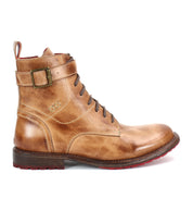 The Bed Stu Endure is a brown leather lace-up ankle boot featuring a side buckle, red sole accents, and detailed stitching, exuding rugged sophistication and shown in profile against a white background.