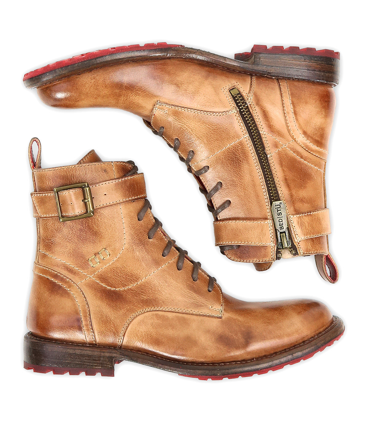 The Bed Stu Endure boots feature a tan leather upper, lace-up front, side zippers, buckles, red rubber soles, and leather lining for rugged sophistication. Shown in a side view.