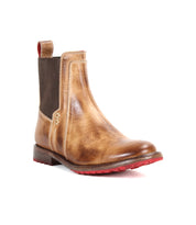 The Ethic boot by Bed Stu is a brown vegetable-tanned leather Chelsea style with a side elastic panel, red pull tab, and red Vibram sole, shown against a white background.