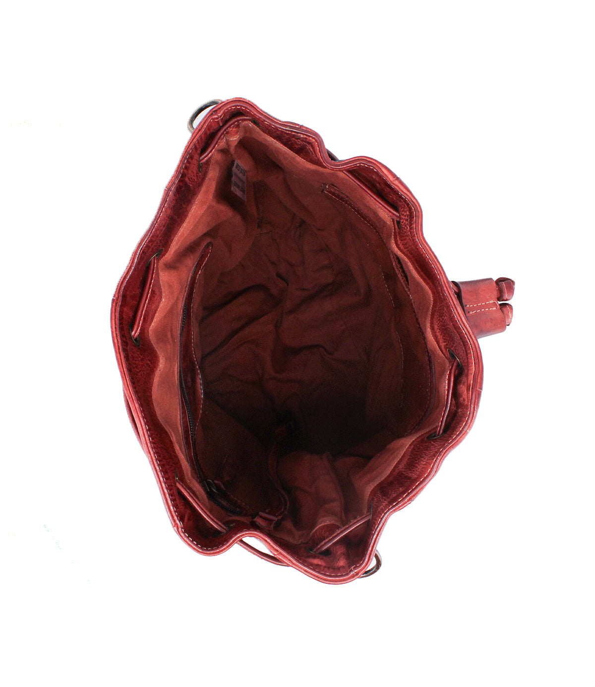 Top view of the Bed Stu Eve, an empty red bucket bag featuring an open main compartment, visible interior side pockets, and a crossbody strap.
