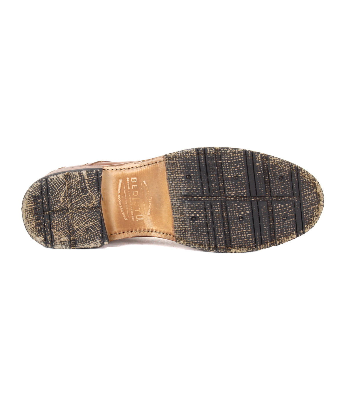 The image shows the bottom view of the Bed Stu Fierce Men’s derby shoe, featuring a worn textured rubber sole and branded leather midsole that combine classic style with a modern twist.