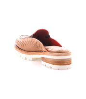 The Bed Stu Fuel is a tan handwoven leather slip-on shoe with a thick white and tan layered sole, shown from the back on a white background, designed for a secure, flexible fit.