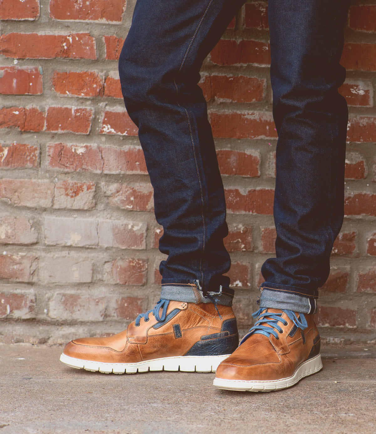 A pair of Bed Stu Galahad jeans and leather sneakers with a comfortable insole.