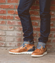 A pair of Bed Stu Galahad jeans and leather sneakers with a comfortable insole.