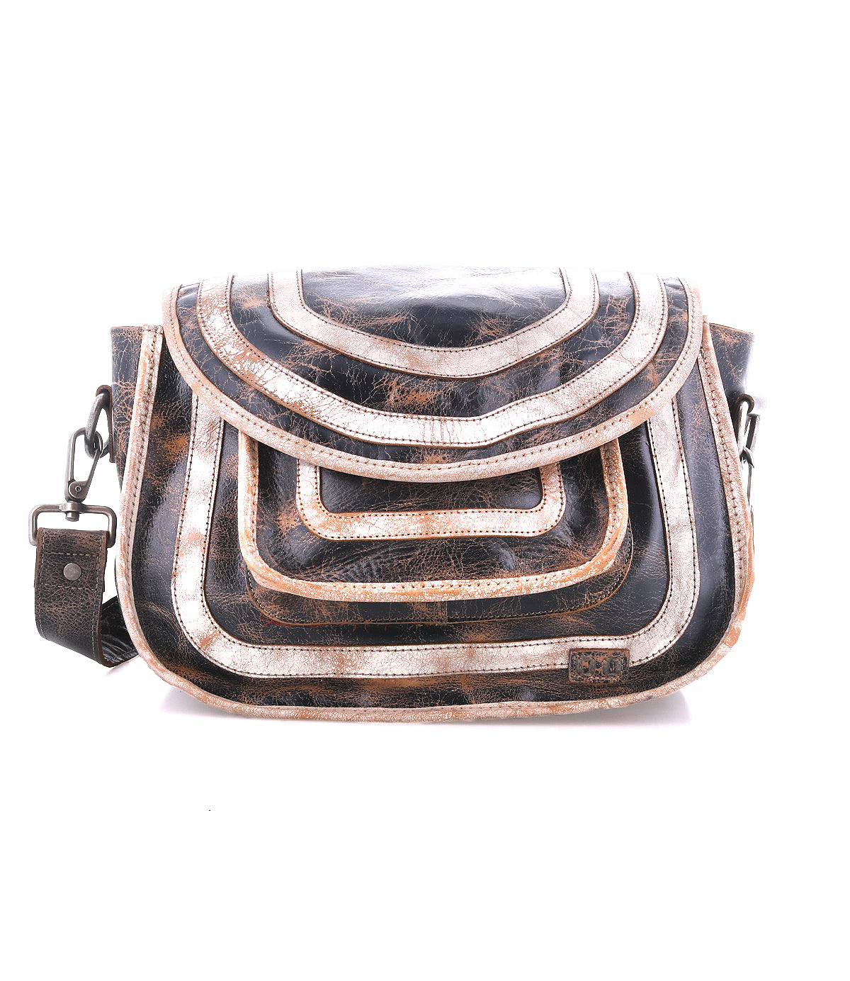 The Bed Stu Gilda is a spacious leather shoulder bag with a flap closure, adorned with layered arc designs in brown, black, and metallic hues—a stylish and functional crossbody for everyday use.