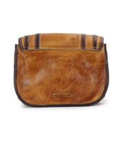 The Gilda by Bed Stu is a brown leather clutch with dual-finished leather, featuring dark trim and the brand's logo on the front.