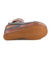 Bottom view of the Bed Stu Harmonious sandal—a brown platform with a smooth, solid sole, slight wedge heel, leather upper, and subtle brogue-style perforations for detail.