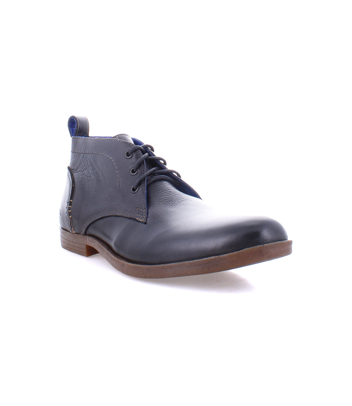 A single Illiad navy blue leather chukka boot with laces on a white background by Bed Stu.
