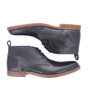 A pair of black vegetable-tanned leather Bed Stu Illiad men's dress shoes with blue pull tabs and laces, displayed against a white background.