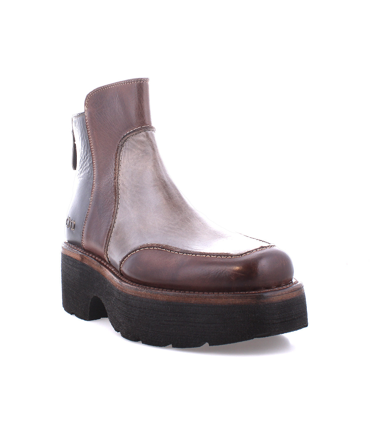 The Infamy ankle boot by Bed Stu features a brown leather design with a rugged, chunky black outsole and visible stitching that highlights its exquisite finishes.