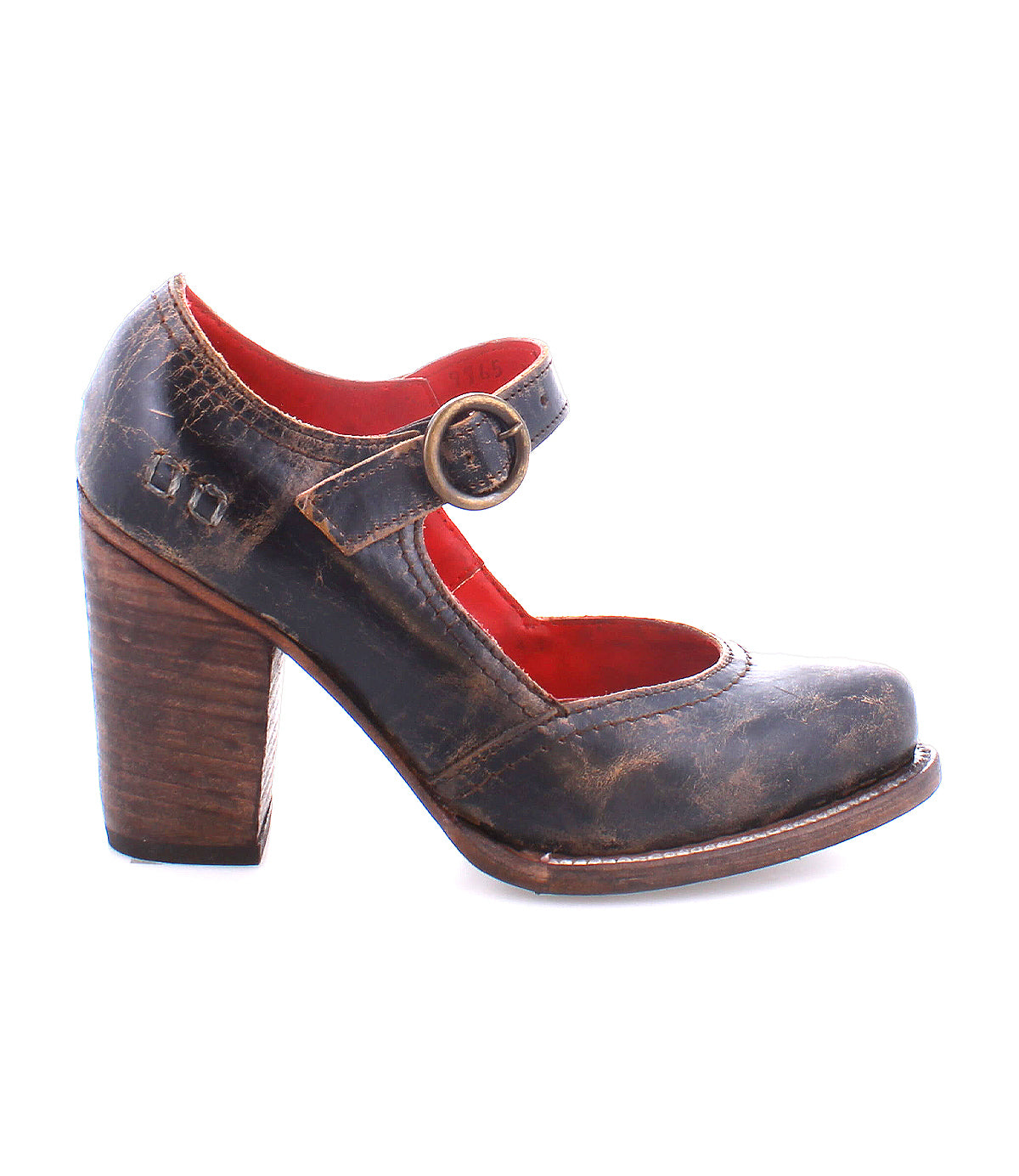 A worn, dark brown Ishtar mary jane pump by Bed Stu with an adjustable strap and block heel, displayed against a white background.