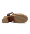 The back of a Jetsetter women's sandal with a wooden sole and leather heels by Bed Stu.