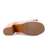 A Jinkie women's shoe with a wooden sole and an adjustable ankle buckle. (Brand Name: Bed Stu)
