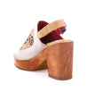 A pair of Bed Stu Jinkie women's open-toe leather shoes with a wooden heel.