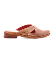 The Bed Stu Jockey is a brown leather slip-on mule with a sleek design, low wooden heel, decorative stitching on the upper strap, and red interior lining, shown in profile against a white background.