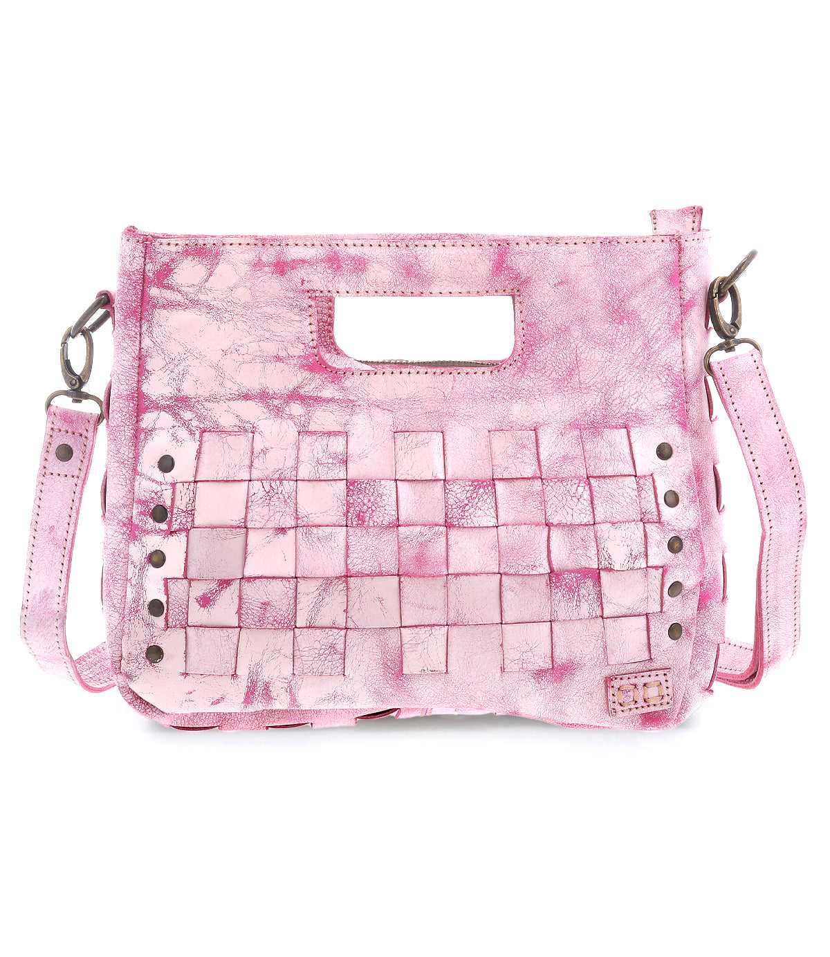 The Keiki by Bed Stu is a pink leather handbag with a textured finish, cutout handle, and woven panels. Adorned with studs, it features an adjustable shoulder strap for crossbody wear and a zip-top closure for security.