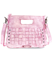 The Bed Stu "Keiki" is a pink leather handbag featuring woven panels, a cutout handle, rivet details, and a zip-top closure. It comes with a detachable strap for versatile wear.