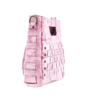 The Keiki by Bed Stu is a pink textured crossbody handbag featuring woven panels, decorative metal eyelets, and a secure zip-top closure.