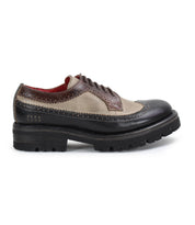 A retro chic two-tone Oxford shoe with brown and beige leather, a black thick sole, and detailed stitching from Bed Stu is called the Lita K III.