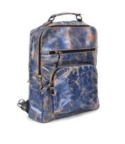 The Bed Stu Lafe is a blue and brown distressed leather backpack with a top handle, front zippered pocket, and silver-tone zippers—ideal as a travel carry-on or work bag, displayed against a white background.