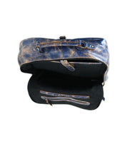 Open view of the Bed Stu Lafe distressed blue leather backpack showing a spacious main compartment, zippered pocket, and small slip pocket—perfect as a travel carry-on or stylish work bag, set against a white background.