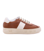 A brown and white casual sneaker featuring a beige sole and white shoelaces, boasting an avant-garde design for a modern twist: the Law by Bed Stu.