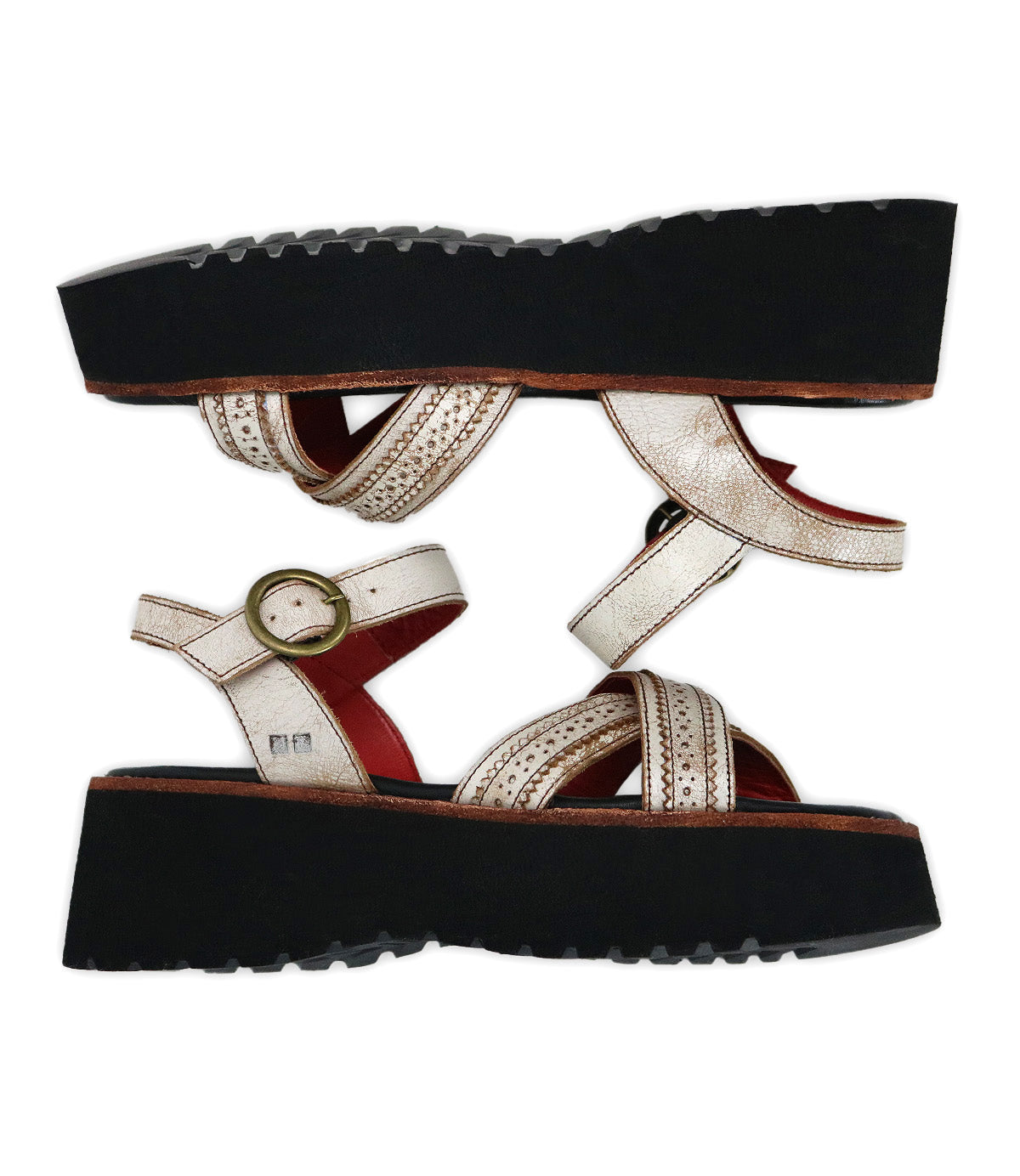 A pair of Bed Stu Lift white leather platform sandals, featuring thick black soles and adjustable ankle straps with gold buckles, are positioned sole to sole on a white background.