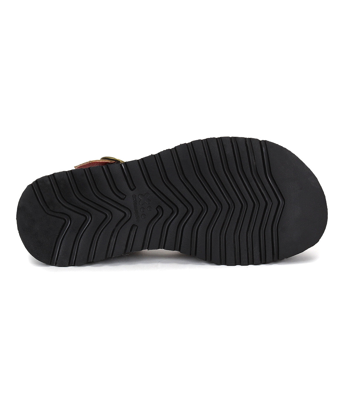 The image shows the bottom view of Bed Stu's Lift sandal: a black rubber sole with deep, angled grooves for traction, offering comfort and stability—perfect for this platform sandal with an adjustable strap.