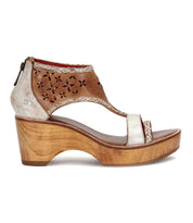Side view of the Bed Stu Locket, a vintage-inspired sandal with decorative laser-cut floral details, an ankle strap, and a wooden platform wedge heel.