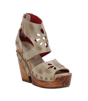 A women's sandal with wooden platform and leather straps from Bed Stu's Lucrative collection.