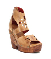 A Bed Stu Lucrative women's sandal with wooden wedges and cut outs.