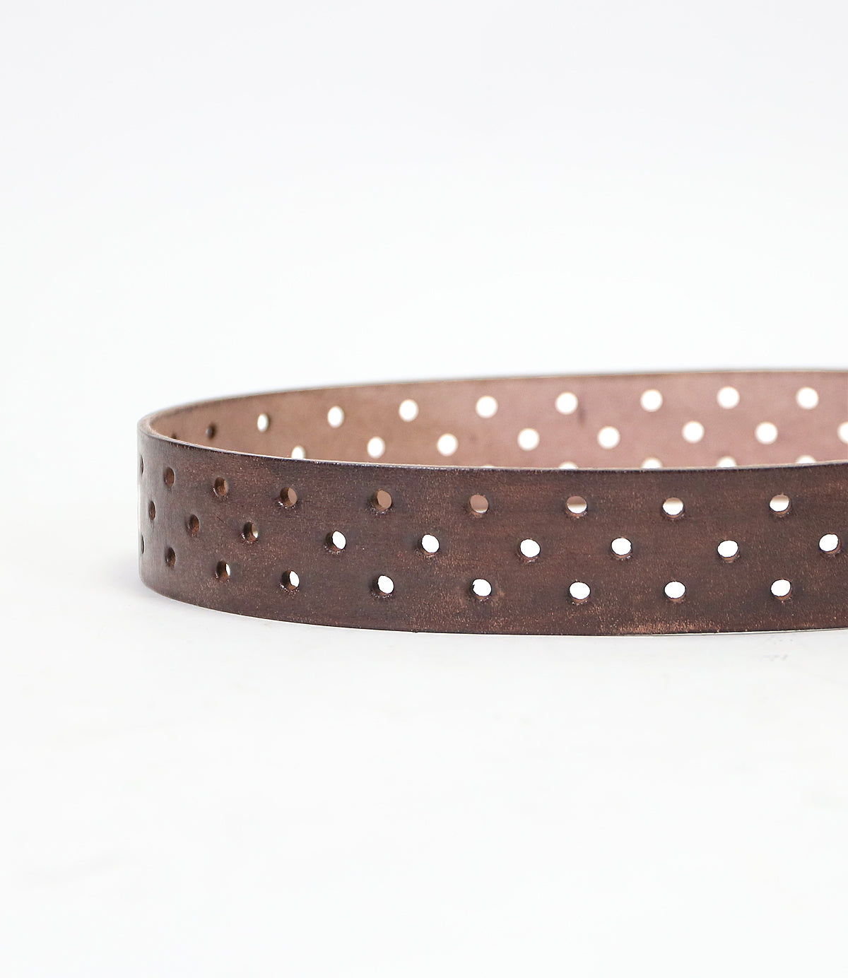 Brown McCoy vegetable-tanned leather belt with multiple perforations displayed on a white background by Bed Stu.