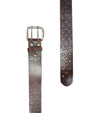 Two Mccoy vegetable-tanned leather belts with metal studs, one buckled, isolated on a white background by Bed Stu.
