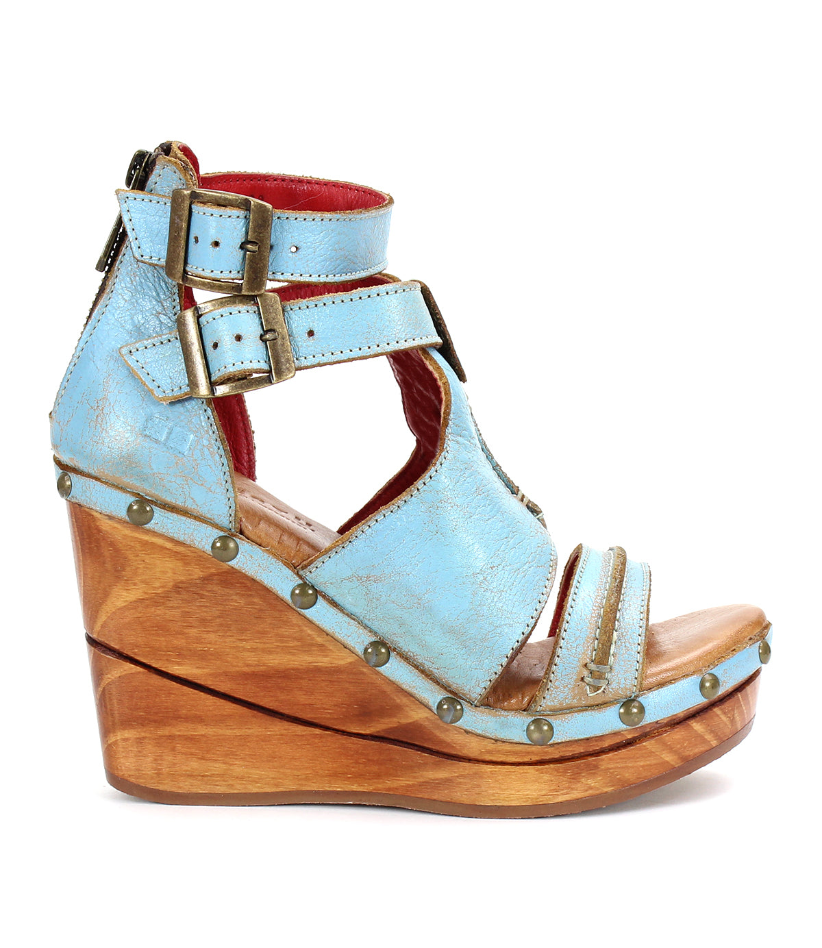A women's blue wedge sandal called "Princess" from the brand "Bed Stu" with sustainable wooden platform and woven strappy uppers.