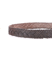 A close-up of the Bed Stu Proem handwoven leather brown belt with a vintage metal buckle, set against a white background.