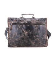 The Bed Stu Pub messenger bag features distressed brown leather, a top handle, metal buckle, front zippered pocket, and adjustable shoulder strap, displayed on a white background.