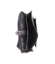 Top view of the Bed Stu Pub wallet—an empty, worn, dark-colored leather accessory with multiple compartments and a metal buckle closure—displayed on a white background.