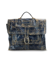 Presenting the Pub by Bed Stu, a chic satchel crafted from weathered leather, featuring a buckle closure and stud accents. This bag boasts a top handle and is designed in a rectangular briefcase shape.